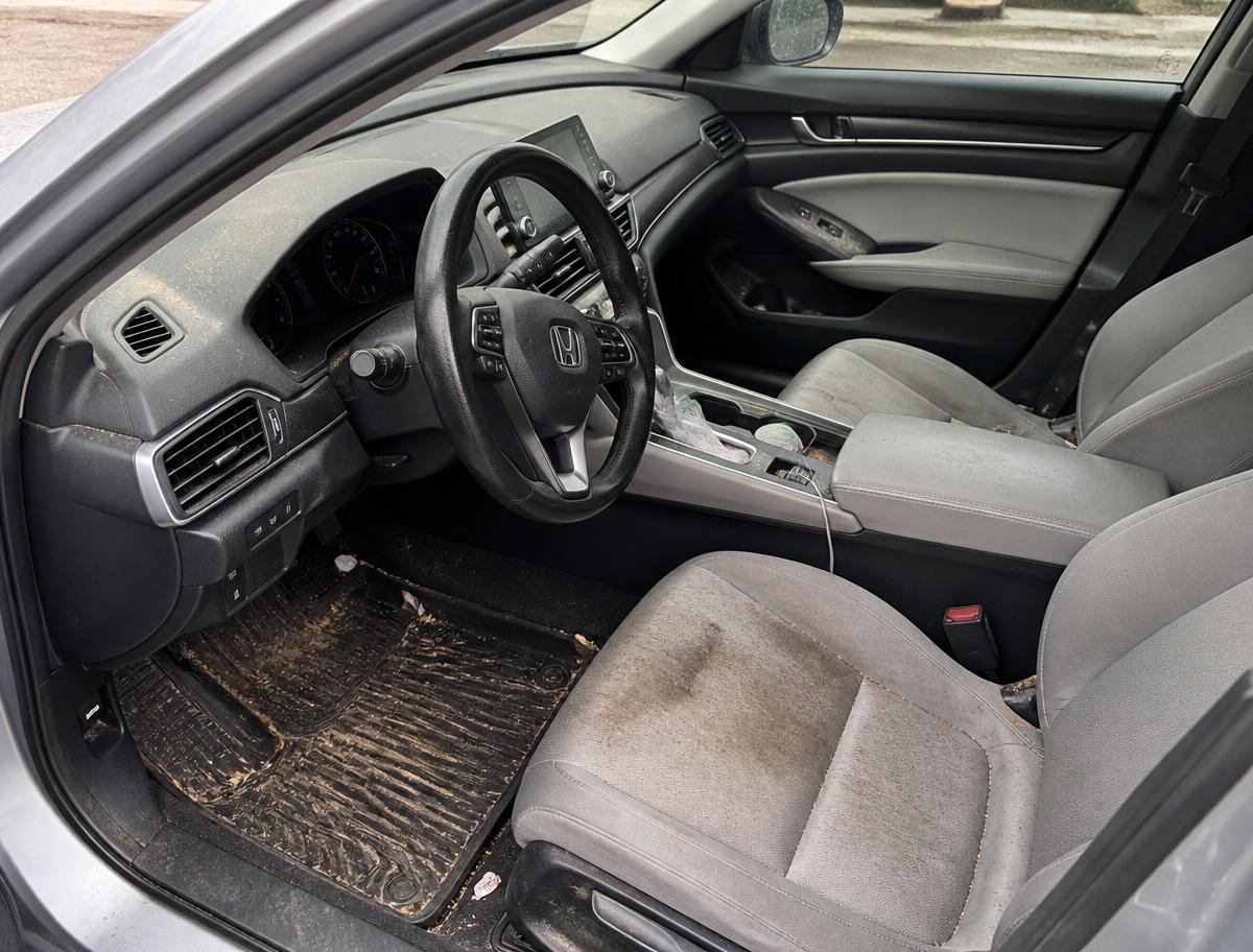 Dirty sedan interior before detailing